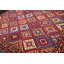 Tapis rouge géométrique en laine bouclé