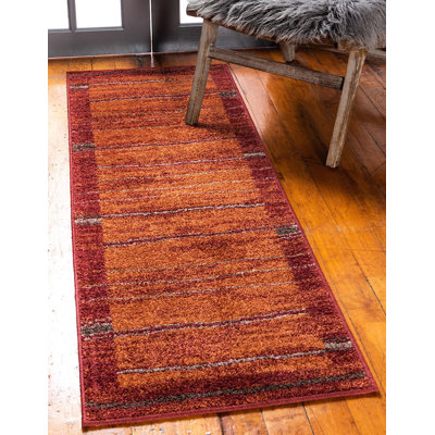 Tapis à motif géométrique rouge / orange Harvest