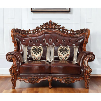 69" Brown And Walnut Top Grain Leather Curved Loveseat and Toss Pillows