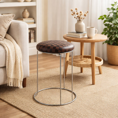 Petit tabouret à motif brun noir avec structure argentée et siège en tissu