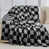 Tissu écossais noir et gris