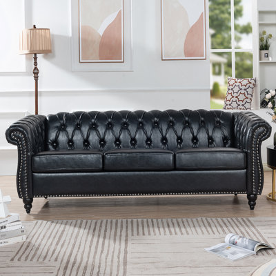 PU Rolled Arm Chesterfield Three Seater Sofa.