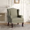 Fauteuil à oreilles rembourré en lin brun clair avec accoudoirs roulés et pieds en bois massif Duward
