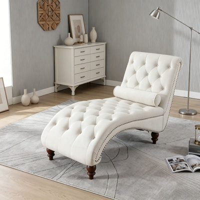 Fauteuil inclinable en velours capitonné