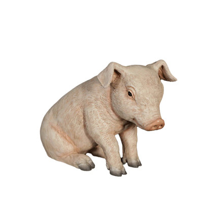 Statue de cochon assis