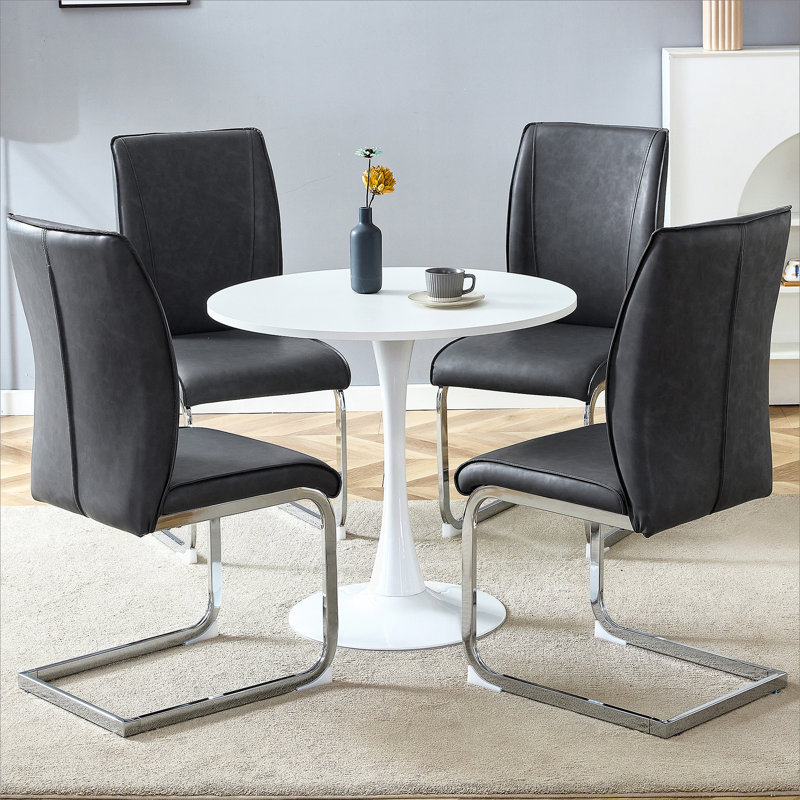 Ensemble de table et de chaises. Petite table ronde stable en forme de verre - 31,9 po x 31,9 po avec chaise en polyuréthane doux et confortable avec pieds en métal arqués argentés.