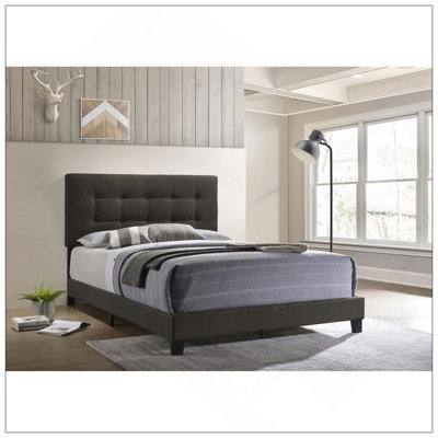 Lit à panneaux capitonné gris anthracite avec plateforme basse, parfait pour un décor de chambre à coucher moderne et sophistiqué