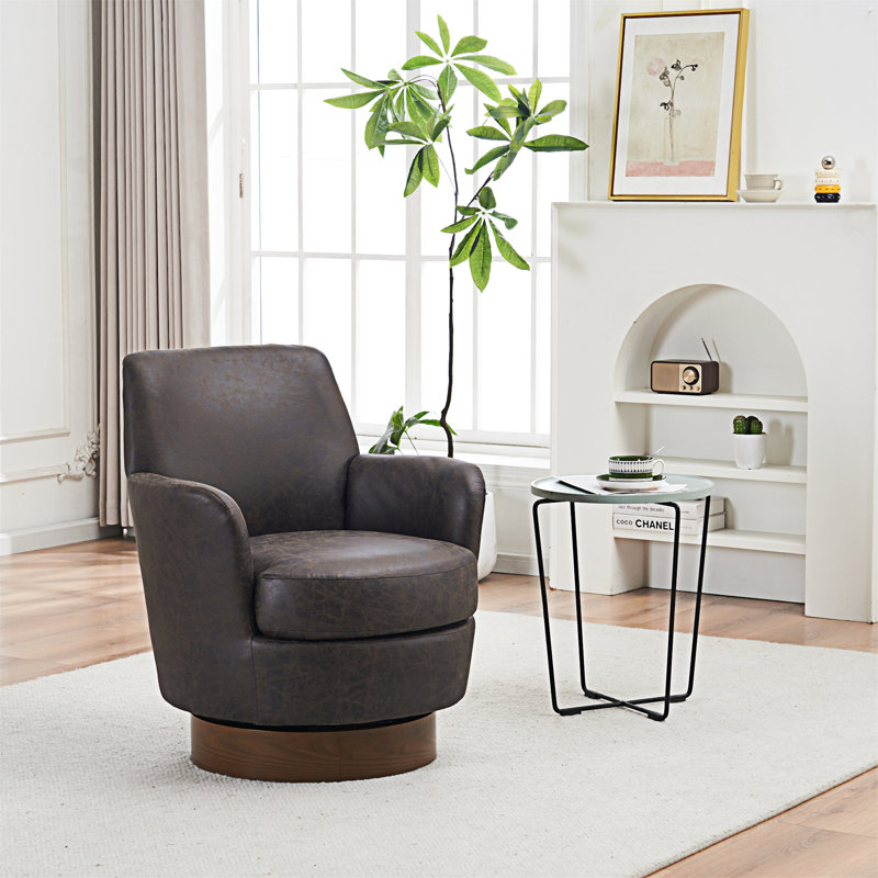 Fauteuil demi-tonneau pivotant en similicuir