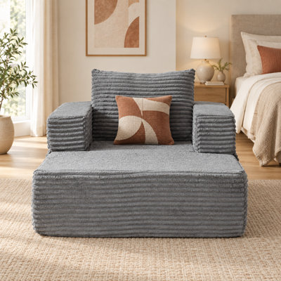Fauteuil lounge modulaire surdimensionné Virelquessa en velours côtelé de 116 cm de large avec accoudoirs amovibles, poches de rangement et coussin décoratif