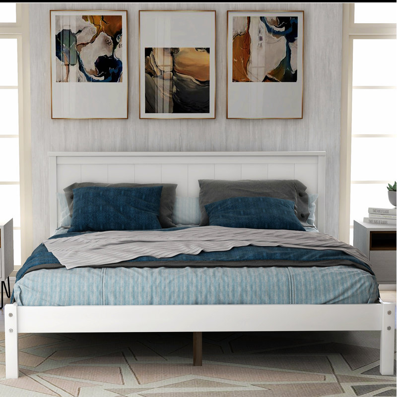 Élégante base de lit plateforme en bois avec tête de lit élégante, offrant confort et durabilité pour une bonne nuit de sommeil.