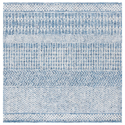 Tapis oriental ivoire / bleu marine en laine touffeté à la main Ambr