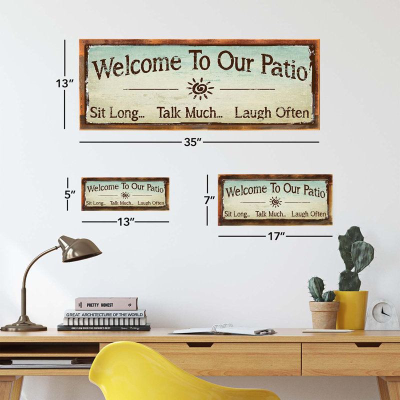 Enseigne encadrée «Welcome to our patio»