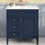 Meuble-lavabo moderne de 76 cm avec lavabo, armoire bleue à 2 tiroirs et rangement fonctionnel.