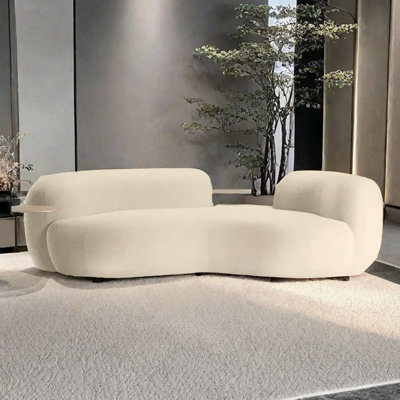 Canapé incurvé léger et luxueux de style crème clair