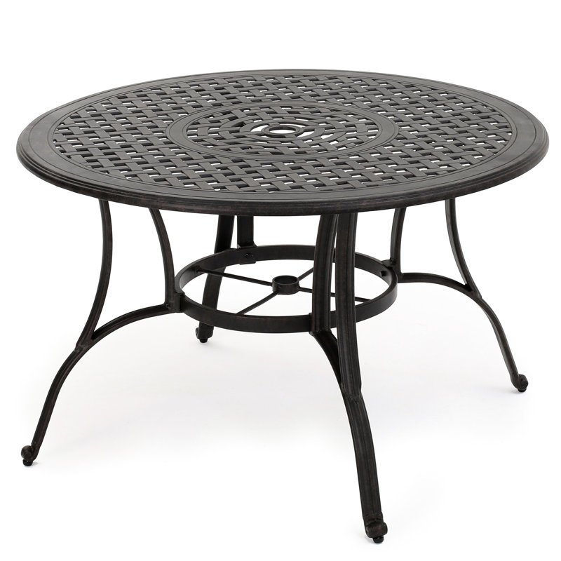 Table de salle à manger extérieure en fonte d'aluminium bronze avec des meubles chaleureux