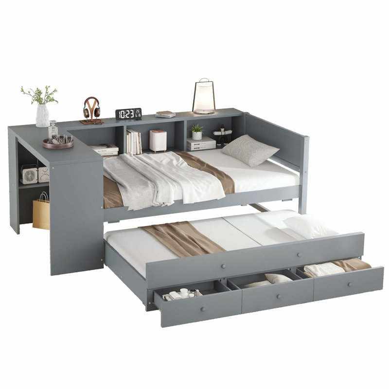 Lit de jour simple en bois avec lit gigogne, bureau intégré, tiroirs de rangement et tablettes pour économiser de l'espace.