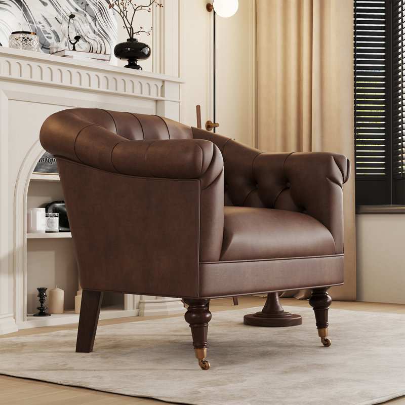 Fauteuil club en cuir avec dossier et roulettes capitonnés