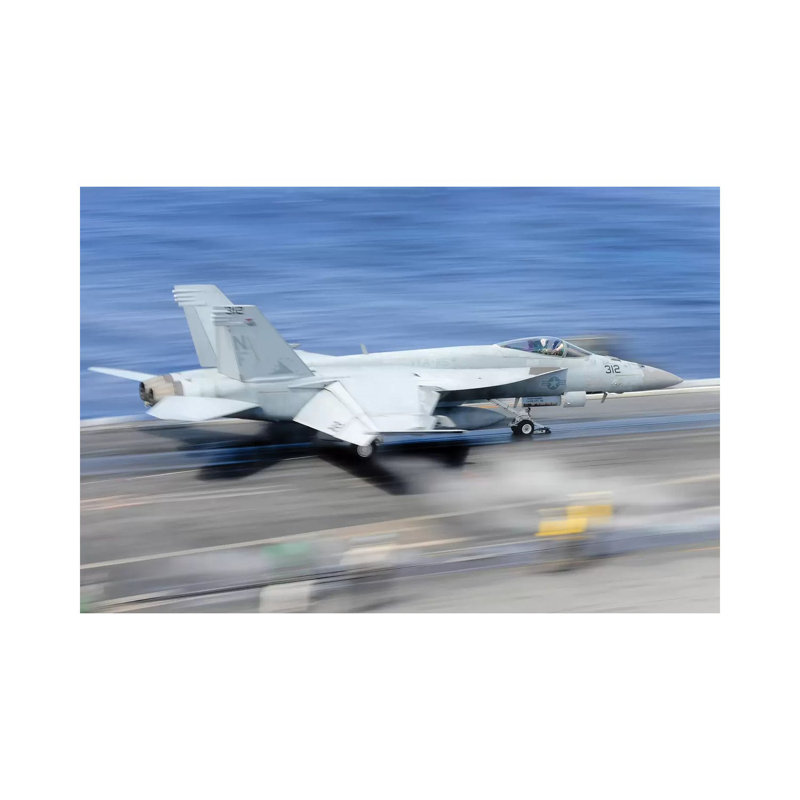 An F/A-18E Super Hornet Launches From The Aircraft Carrier USS George Washington by Stocktrek Images - Wrapped Canvas Print
