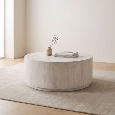 Rustic Gray 42" Round Coffee Table with Sculptural Cylindrical Design