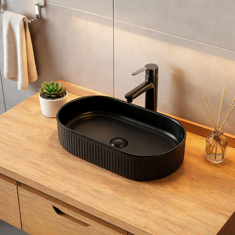 Lavabo ovale en céramique noire de 48 cm x 30 cm avec fini lustré