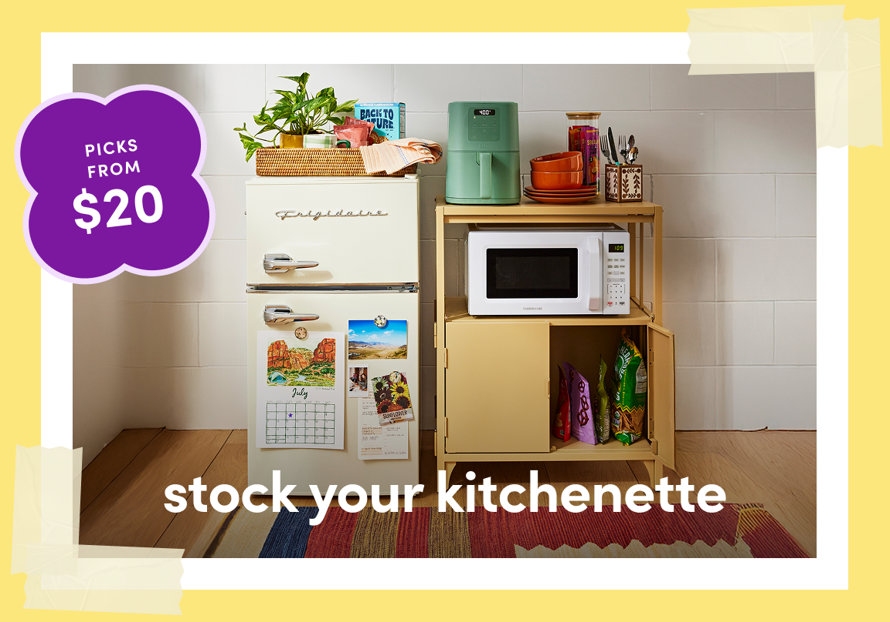 Retro Frigidaire refrigerator with dorm essentials including a mint green air fryer, microwave, bowls, and snacks on a wooden shelf, with picks from $20 badge