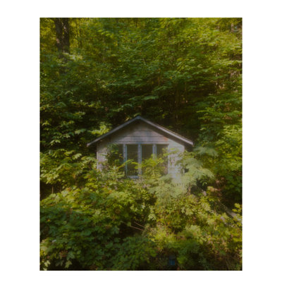 “Undisclosed Location” 2025 Series Framed Wall Art by Sydney A. Foster | Solitary Structure in Lush Green Landscape