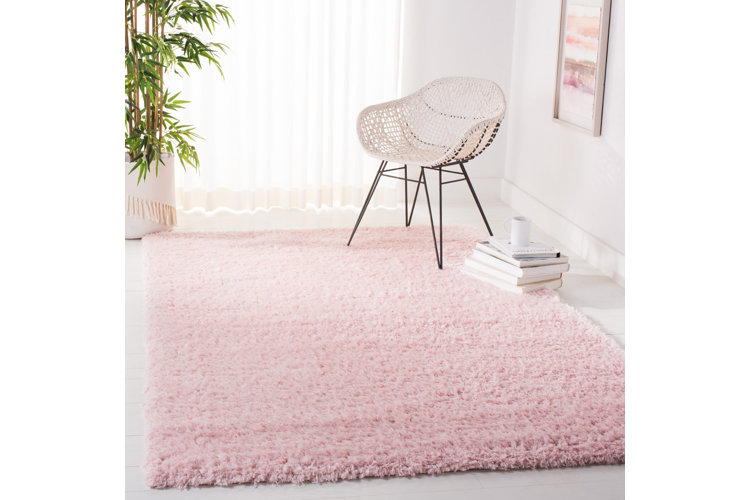 pink shag rug with white chair
