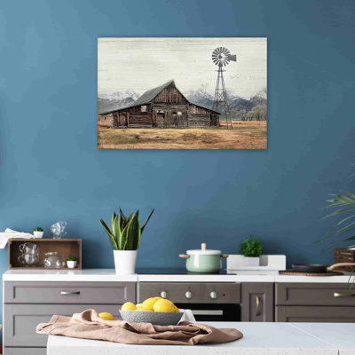 Vieille grange sous les montagnes enneigées sur toile