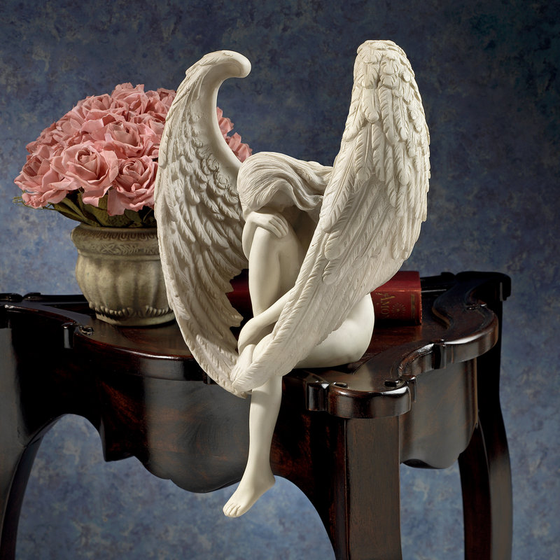Statue ange assis