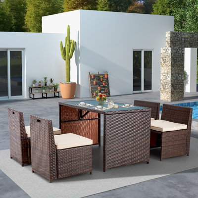 Yushin 5 Pieces Patio Dining Set, Space Saving Wicker Patio Furniture Conversation Set With Glass Table And Seat Cushions, Outdoor Sectional Table And -  Latitude RunÂ®, 482394D682724D9EAB8F3773FBC38A6B