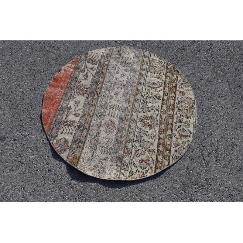 Tapis de porte rond rond de style turc avec des motifs complexes et des tons terreux pour un décor décoratif