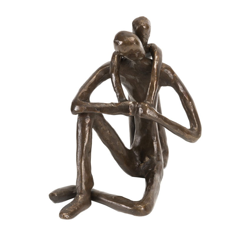 Sculpture de Zylstran, enfant embrassant son père