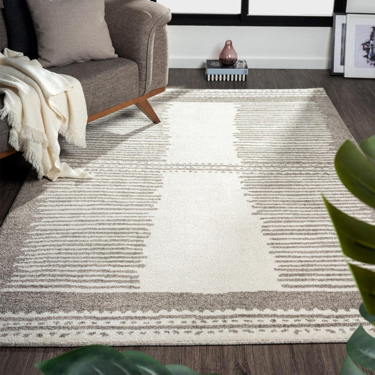 Tapis tribal à motif géométrique brun