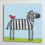 «A Zebra With Red Bird», reproduction sur toile tendue-17863301