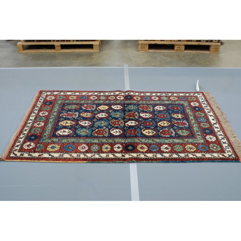 Seychour Wool Oriental Area Rug in Green/Red