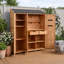 Abri de jardin extérieur avec trois portes, sept tablettes, deux tiroirs, six crochets et un poste de travail-132664369