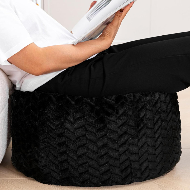 Pouf rond noir avec rembourrage en mousse