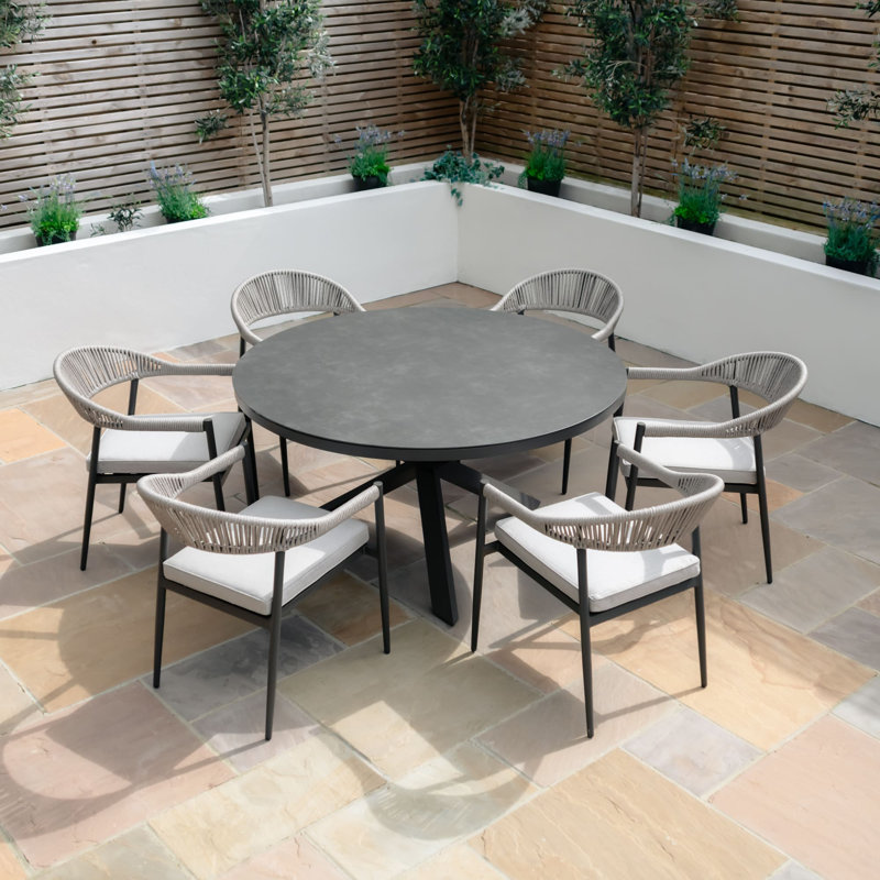 Oliveros 6 - Person Patio Dining Set with Round Table , Cushions Included