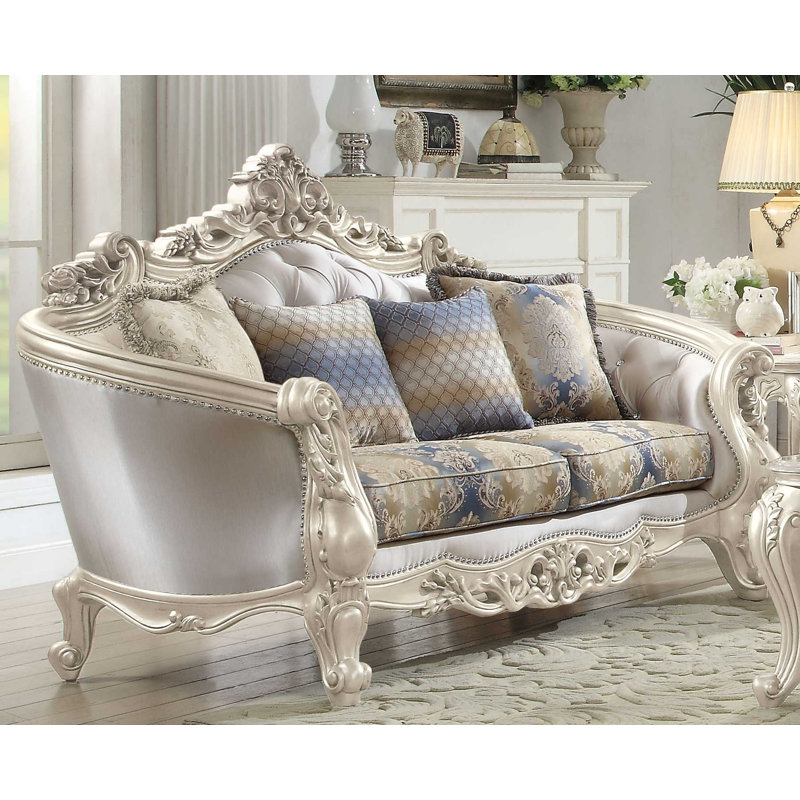 Elegant Floral Tufted Fabric Loveseat with Rolled Arms and Nailhead Accents