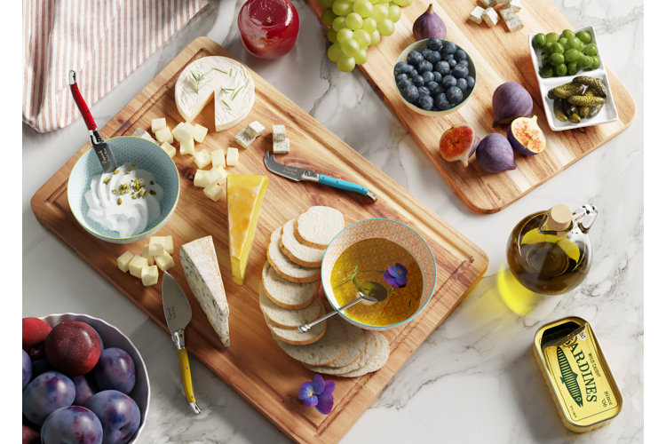 'girl dinner' tiktok trend with a spread of cheese, fruit, dips, and tinned fish