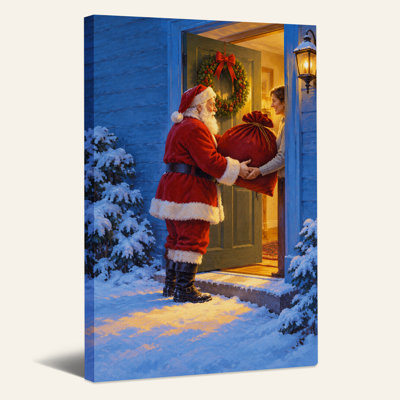 «Santa Claus Handing Red Gift Sack To Woman On Christmas», art mural sur toile