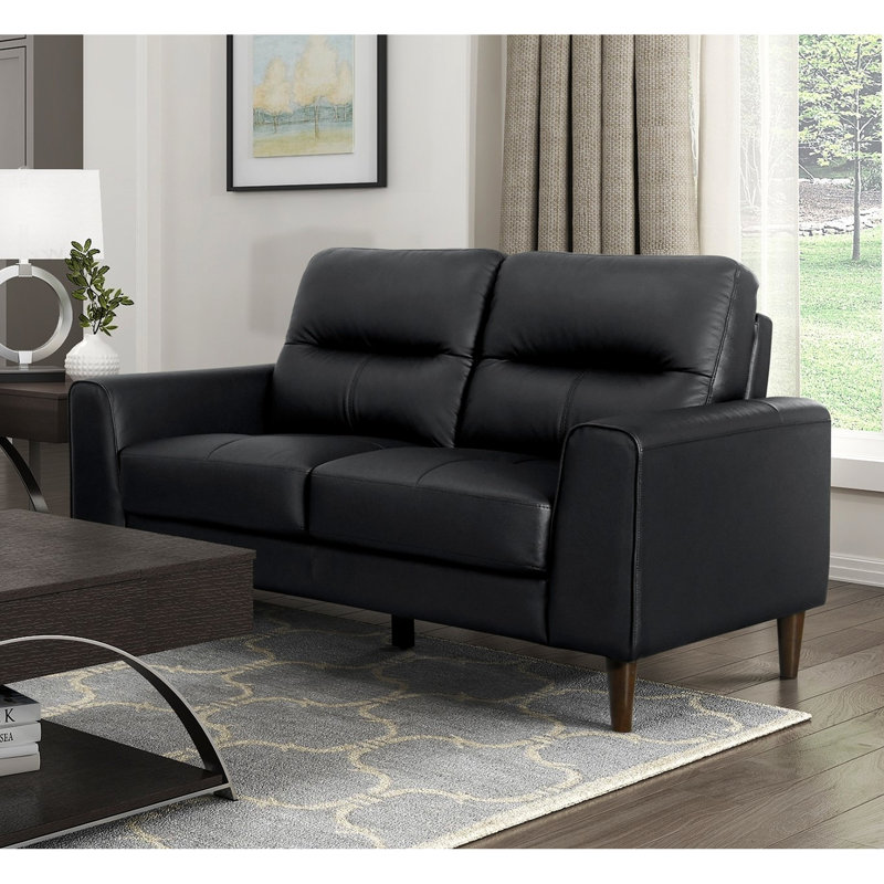 Cuir noir avec coussins en mousse à haute densité, structure en bois massif, largeur de produit de 34,5 po, mousse de siège profilée et profondeur de siège en contreplaqué de 20,5 po, lignes rétro