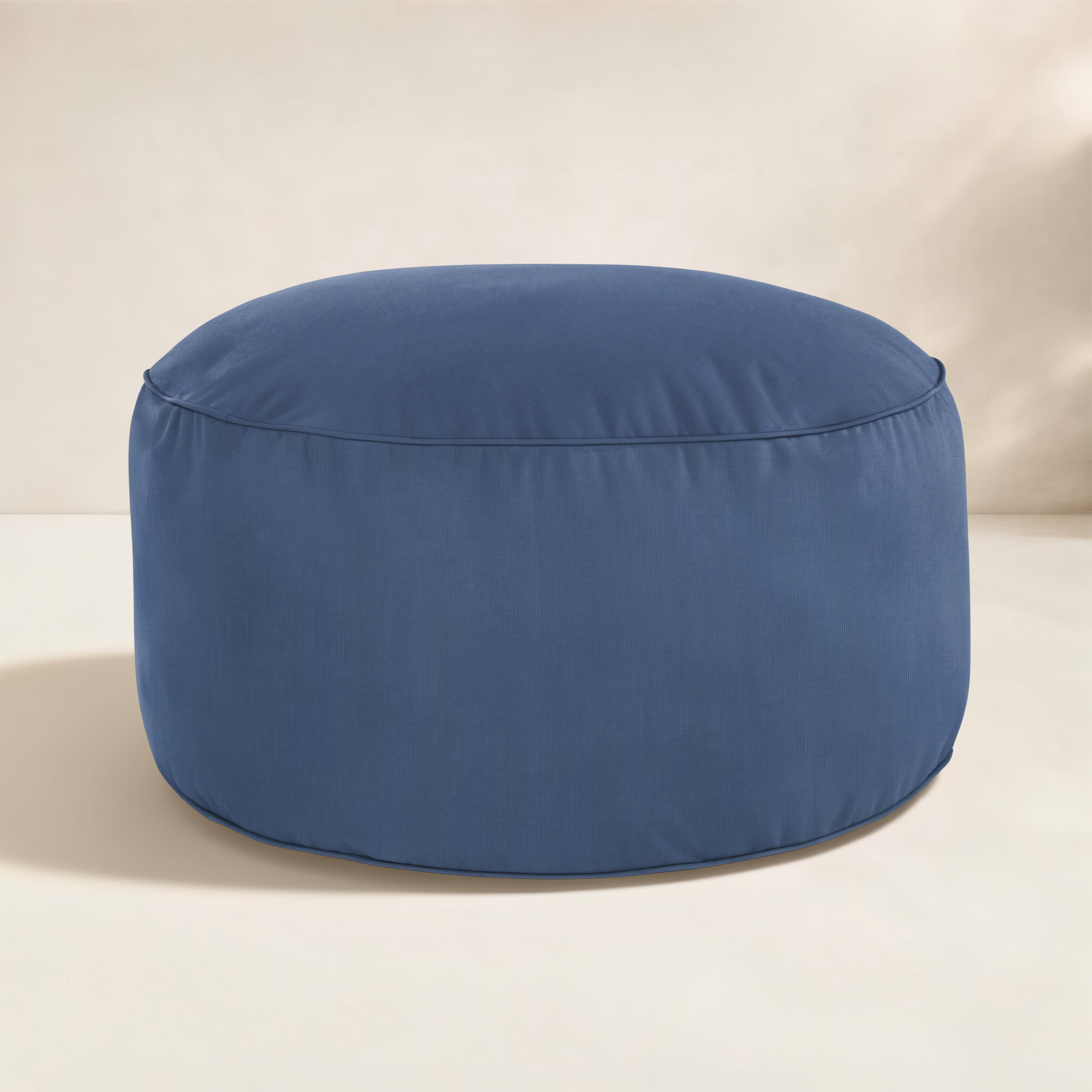 Demi Round Upholstered Outdoor Ottoman with Sunbrella® Cushion, Navy Sunbrella®