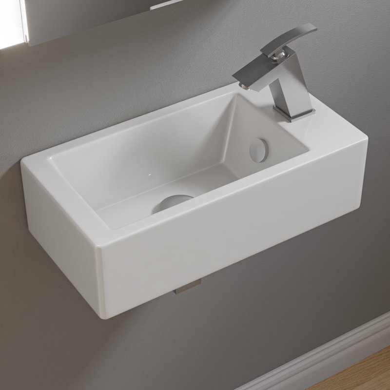 Lavabo de salle de bain mural blanc avec trop-plein