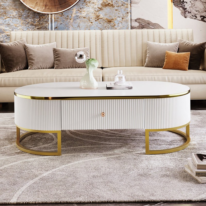 Table basse moderne ovale avec tiroirs, profil profilé incurvé, décor en métal doré