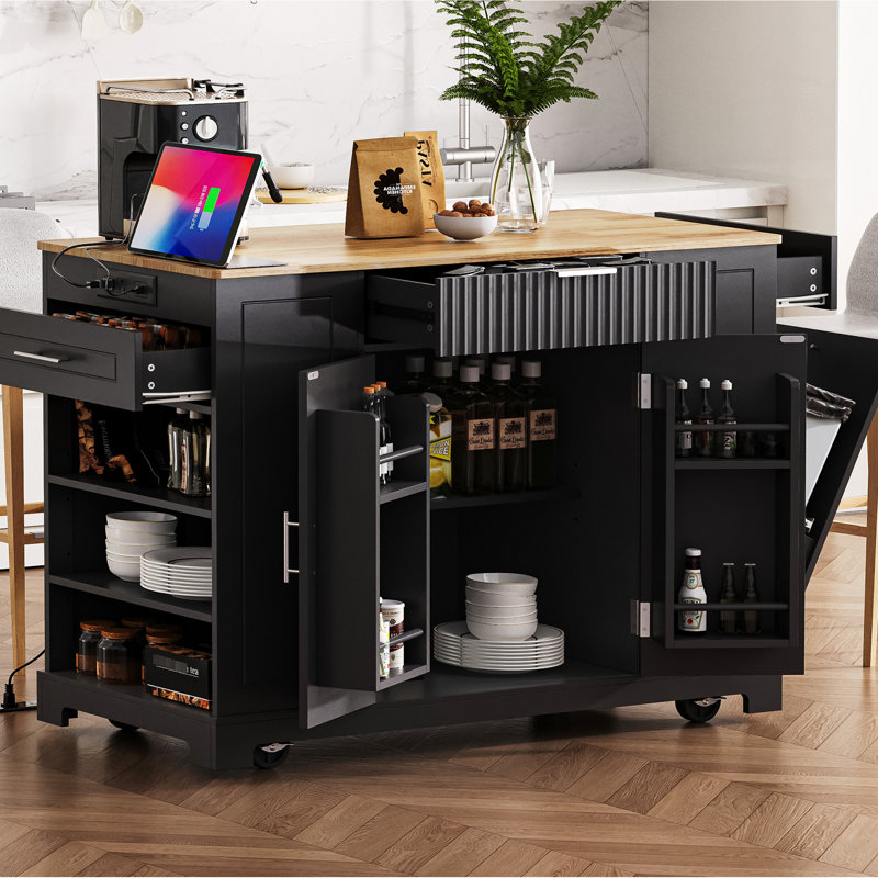Luxury Kitchen Island With Trash Storage Cabinet, Built-In Power, 3 Drawers, Open Side , 5 Rolling Wheels, Black Classic Featuring Garbage Bin Holder, Power Outlet, Shelves, 5 Design,