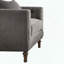 Fauteuil d'appoint en velours gris avec coussin décoratif