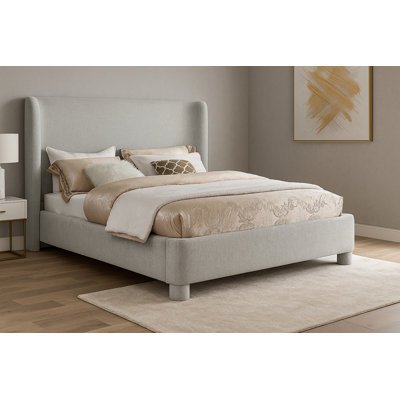 Hridhaan Upholstered Unfinished Wingback Bed