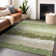 Orren Ellis Premium Machine Washable Tweedy Green Rug | Wayfair