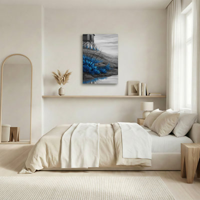 Tableau sur toile représentant un feuillu bleu et un bateau en bois reposant sur une pente grise